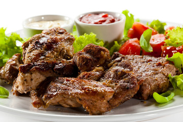 Grilled steaks and vegetables