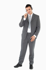 Businessman with headset on against a white background