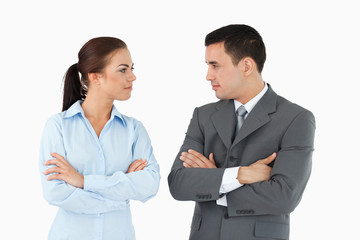 Fototapeta premium Serious business partners with arms folded looking at each other