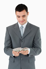 Businessman counting bank notes