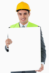 Smiling architect holding sign