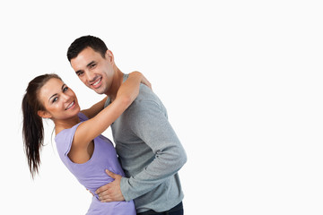 Obraz premium Young couple hugging