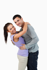 Fototapeta premium Young couple hugging each other