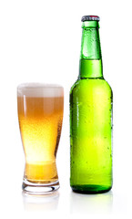 Isolated Glass and Green bottle of beer on a white background