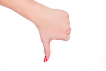 Female hand showing thumbs down symbol.