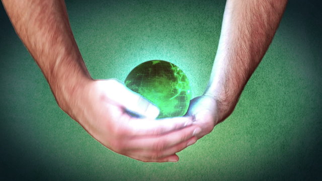 Hands holding a green globe