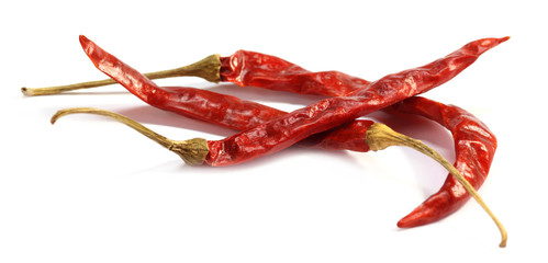 Dried chilies over white background
