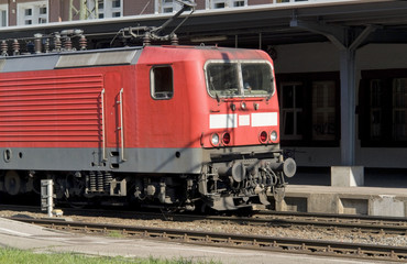 red train in sunny ambiance