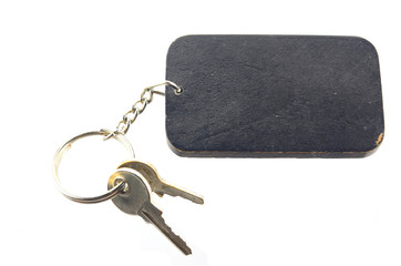 wooden tag with key isolated on white background