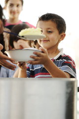 Hungry children in refugee camp humanitarian food