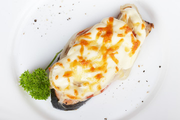 Salmon baked under vegetables and mayonnaise