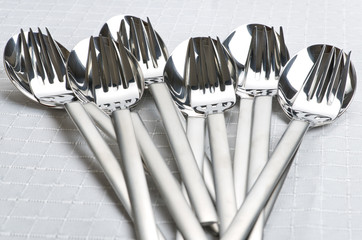 Stack of spoons and forks