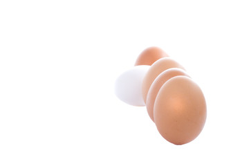 Image of an out of place egg going against the crowd