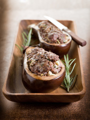 stuffed eggplants on wood dish