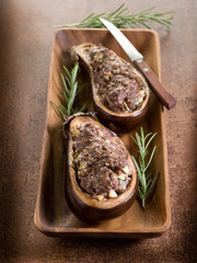 stuffed eggplants on wood dish