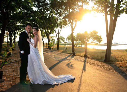 Asian Wedding Couple Posing Outdoor