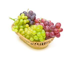 grapes in a basket on a white background