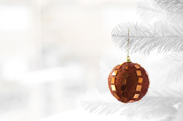 Orange bauble on Christmas Tree