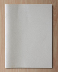 Naklejka na ściany i meble gray recycled notebook on wood background
