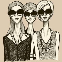trois femmes avec des lunettes de soleil
