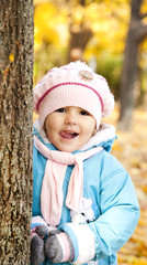 Cute girl in autumn park