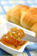 Orange jam and croissant