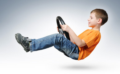 Funny boy car driver with the steering wheel, concept