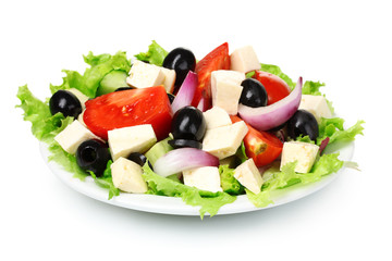 Tasty greek salad on plate isolated on white