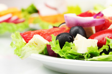 Tasty greek salad on plate closeup