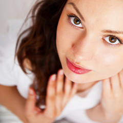 Fototapeta premium Portrait of a charming young lady relaxing on couch