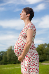 Pregnant woman with closed eyes