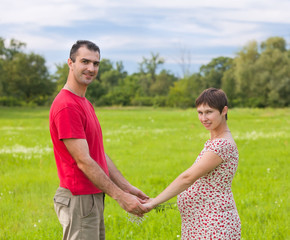 Fototapeta na wymiar Husband with his pregnant wife