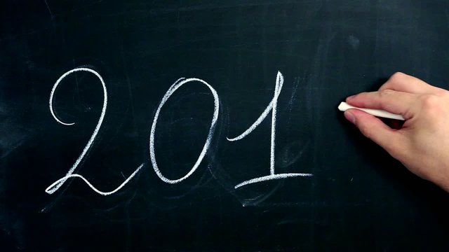 Hand writing 2012 on blackboard