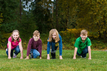 Group of kids at the starting line of a foot race