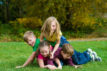Naklejka na ściany i meble Group of kids playing outside