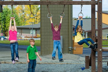A group of kids playing during recess at school playground