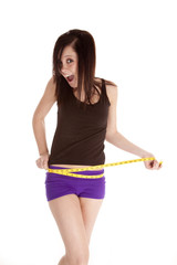 Fototapeta na wymiar woman purple shorts measure waist happy