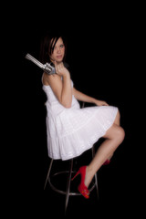 woman white dress red shoes gun