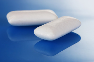 Chewing gums on blue background
