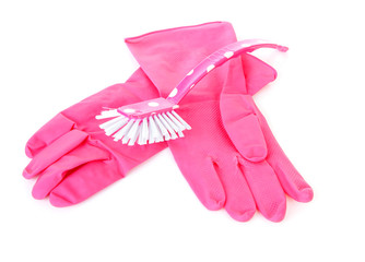 pair of pink household gloves and dish brush
