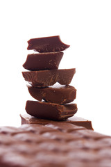 tasty bits of chocolate isolated on white