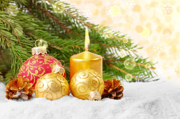 Christmas balls and gold candle