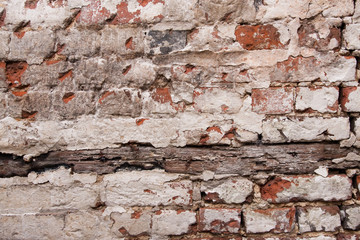 Paint peeling off brick wall in a derelict building