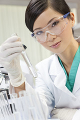 Asian Chinese Female Woman Scientist With Test Tube In Laboratory