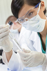 Chinese Female Woman Scientist With Test Tube In Laboratory