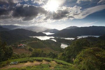 Sunset of the country place with lake and house