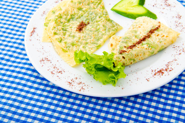 Pancake with herbs in the plate