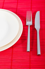 Empty plate with utensils