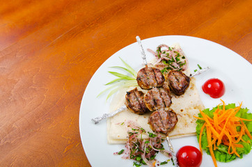 Meat cuisine - kebab served in plate