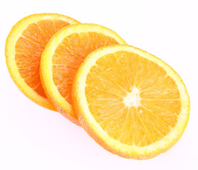 Half an Orange cut into slices on a white background